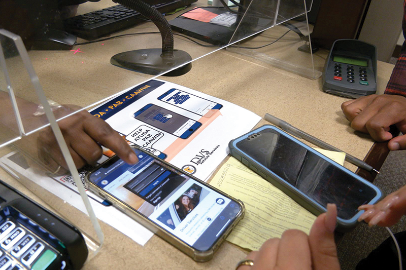 People using the DVS language chatbot on a smartphone People using the DVS language chatbot on a smartphone